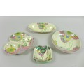 Clarice Cliff for A. J. Wilkinson Ltd and Newport Pottery, a group of four floral pattern pieces, al... 