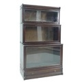 A Globe Wernicke style sectional bookcase, early 20th century, the three graduated sections with gla... 