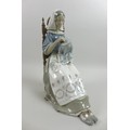 A Lladro figurine, modelled as 'Insular Embroideress', 4865, 13 by 21 by 28cm high.
