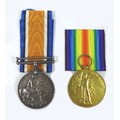 Two civilian WWI medals, a Victory and a War medal, with ribbons both for 'R.H. Grant' and both with... 