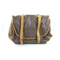 A Louis Vuitton monogrammed Saumer double strap leather bag, with brass buckles, 43 by 8 by 33cm hig... 