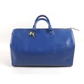 A Louis Vuitton Epi Leather Speedy bag in blue, with black stitching, brass fittings, lock and two k... 