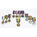 Three groups of WWI and WWII medals including a possible father and son collection, WWI Victory and ... 