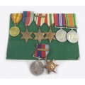 Two groups of WWII medals, comprising a pair, a 1939-1945 star with North Africa 1942-3 clasp, named... 