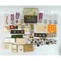 A group of militaria, including WWII medals, and military buttons, one France and Germany star, mini... 