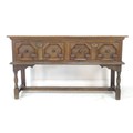An oak sideboard, two frieze drawers with Commonwealth style moulded geometric decoration, turned kn... 