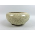 A Chinese Qing Dynasty, 19th century, Ge type stoneware bowl, with cream crackle glaze, of squat for... 