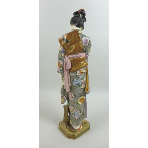 10 - A good Japanese Satsuma porcelain figure by Kinkozan, Meiji period, modelled as a young Japanese wom... 