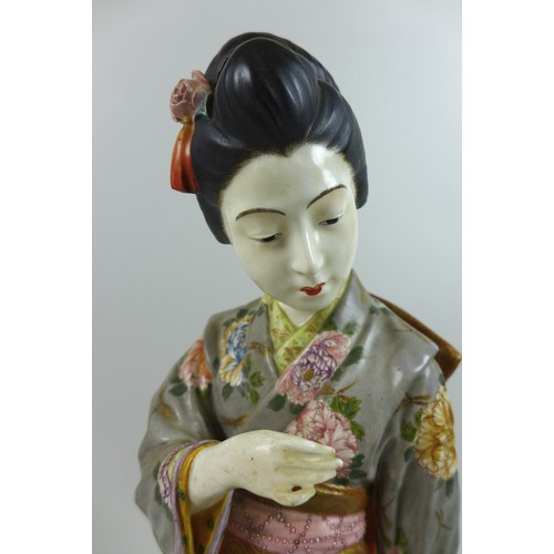 10 - A good Japanese Satsuma porcelain figure by Kinkozan, Meiji period, modelled as a young Japanese wom... 