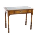 A late Victorian Gillows oak writing desk, of small proportions, with inset green and gilt tooled le... 
