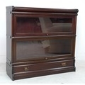 An Edwardian Globe Wernicke mahogany sectional bookcase, the two graduated glazed sections with lift... 