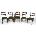 A set of four William IV rosewood dining chairs, shaped back with carved mid-rail, drop in green vel... 