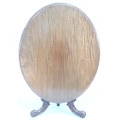 A late Victorian mahogany breakfast table, the oval tilt top with moulded edge, on a baluster column... 