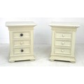 A pair of modern cream painted bedside cabinets, each with three drawers, 48 by 38 by 83cm high, tog... 