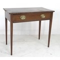 A Regency mahogany side table, single frieze drawer with later brass embossed plate handles depictin... 