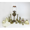 A collection of brass candlesticks, including an unusual 19th century sprung ejector example with la... 