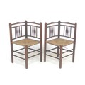A pair of early Edwardian mahogany, Arts & Crafts, stick back corner chairs, with rush seats, 56 by ... 