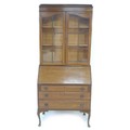A mid 20th century mahogany bureau bookcase, twin glazed doors enclosing two fixed shelves, fall fro... 
