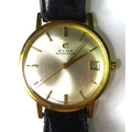 An 18k gold cased Cyma Autorotor gentlemen's wristwatch, circa 1960, circular silvered dial with gol... 