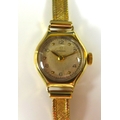 An Omega 9ct gold lady's wristwatch, with circular dial, gold dot and black Arabic numerals, on a 9c... 