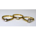 A group of three 9ct gold and diamond solitaire rings, diamonds sized between 0.1 and 0.2ct, size K/... 