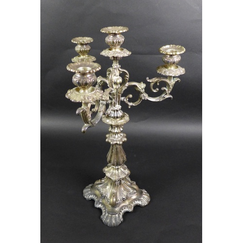 63 - A Continental white metal candelabra, late 19th century, in Rococo style with scrolling foliate deco... 