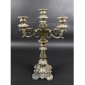A Continental white metal candelabra, late 19th century, in Rococo style with scrolling foliate deco... 