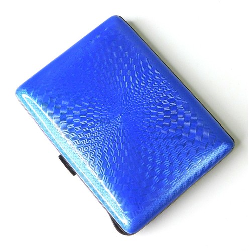 121 - A silver cigarette case with engine turned cornflower blue enamelled lid, parcel gilt interior, TK &... 