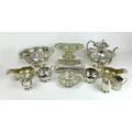 A group of silver plated wares, including a teapot, coffee pot, a pair of gravy boats, and several s... 