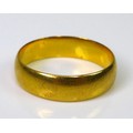 A 22ct gold band, size K/L, 3.5g.