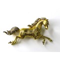 An 18ct gold horse brooch, modelled in a galloping pose, with textured yellow gold body, diamond set... 