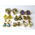 Eight pairs of 9ct gold earrings, all clip on or screw back styles, including a pair of spherical tu... 