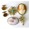 A group of 9ct gold jewellery, comprising two cameo brooches, a textured starburst brooch set with t... 