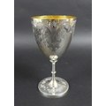 A Victorian silver goblet, with gilt interior, engraved decoration raised upon a circular base, 9.3 ... 