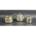 A Victorian three piece silver tea set, comprising a teapot with fruit finial, 23.5 by 13.5 by 14cm ... 