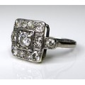 An Art Deco diamond, 18ct white gold and platinum cluster ring, with central stone approximately 0.2... 