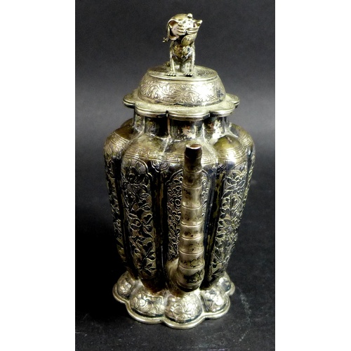 1 - A 19th century Chinese silver wine pot, of lobed tapering form, the cover with shi shi finial, faux ... 