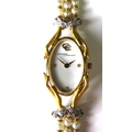 A Carrera y Carrera 18ct gold and diamond lady's dress wristwatch, oval mother of pearl dial with di... 