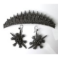 A 19th century steel cut tiara set, with brooch pin backing, 10 by 2.6cm, together with a pair of si... 