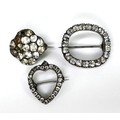 A group of three Georgian and later paste brooches, comprising an open heart shape, open oval shape,... 