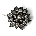 A late Georgian pearl and paste set floral brooch, the central pearl surrounded by individually form... 