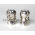 A pair of contemporary silver novelty salt and pepper pots, modelled as champagne corks, AD, London ... 