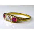 An 18ct gold, diamond and ruby ring, of Georgian style, the central brilliant cut diamond of approxi... 