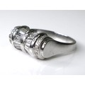 An Art Deco style platinum and diamond ring of unusual tapered barrel design, set with twelve baguet... 