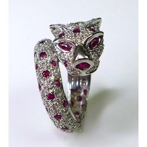 200 - A 18ct white gold, diamond and ruby ring in the form of a coiled panther, by Brooks & Bentley, Londo... 