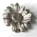 A silver sunflower brooch by Mellerio dits Mellor, stamped to back 'Mellerio Mellor, Paix 9, Paris',... 