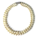 A 19th century double strand of cultured pearls, comprising a strand of forty-two graduated pearls, ... 