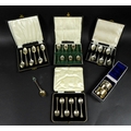 Four cased sets of six  George V and later silver teaspoons, comprising a George V set of six teaspo... 