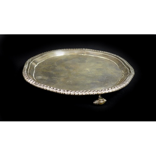 54 - A George III small silver tray, of octagonal form with reeded rim, three scroll feet, maker's mark '... 