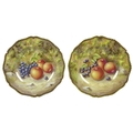 Two modern Royal Worcester cabinet plates, hand painted by N. Creed, each with a fruit study to a mo... 